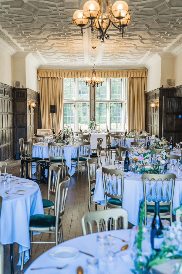 Alice wedding 4 A wedding couple walking towards the camera outdoors holding hands.
